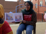 AmeriCorp - youth reading to group of children