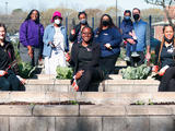 Community garden - group of people facing camera and smiling